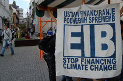 EIB - stop financing climate change! Banner in Ljubljana outside the EIB conference "Mastering climate change."