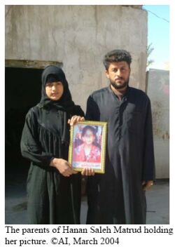 -The parents of Hanan Saleh Matrud holding her picture. © AI, March 2004-